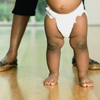 Father changing diaper on baby girl