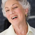 Mature woman laughing, eyes closed, close-up
