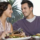 Man giving woman present at picnic in park