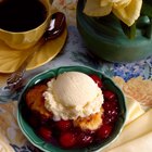 Homemade peach cobbler served with vanilla ice cream