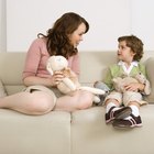 mother with boy lies on meadow