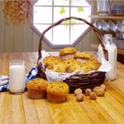 Slice of apple pie on paper on wooden table