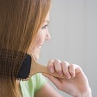 Side profile of a mid adult man talking on a mobile phone