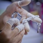 Close-up of a man putting a ring on a woman's finger