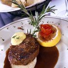 Sauteed liver with onions on blue plate