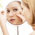 Woman using moisturizing cream