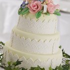 Wedding cake with glaze an eadible silver and flowers