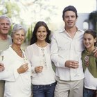 Middle-aged friends greeting in kitchen