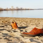 Close-up of a couple's feet on the beach