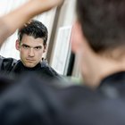 Man combing hair in mirror