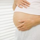 Pregnant woman reflected on a mirror