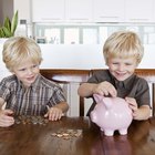 Twin boys and piggy bank