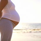 Pregnant woman lying in bed sleeping