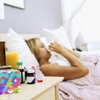Mother caress her baby in bed