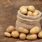 potatoes on a wooden board