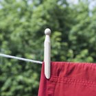 Woman folding clothes in store