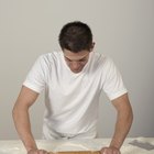 Woman's hands kneading dough in a kitchen