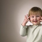 Boy with hands on head