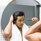 Man admiring hair in mirror