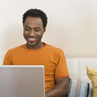 Woman with laptop on couch