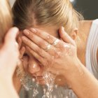 Side view of a woman washing her face