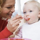 Measuring smiling beautiful comfortable little baby