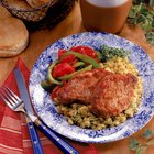 Hispanic woman chopping salad greens