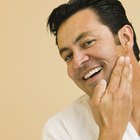 Man shaving with electric razor