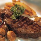 woman eating steak in a restaurant