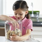 Boy (6-8) reaching into cookie jar