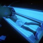 high angle view of a man lying in a tanning machine