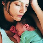 Mother holding feeding baby