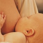 High angle view of a mother breastfeeding her baby boy