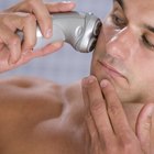 Man using electric shaver