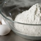 Close up of male baker hands kneading dough