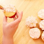 Decorating cupcakes with lemon curd