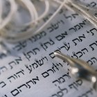 Rosh Hashanah Jewish New Year shofar,tallit. Isolated on black.
