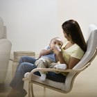 Mother breast feeding baby girl