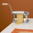 Hanging uncooked fettuccine pasta
