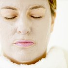 Woman receiving facial treatment at spa