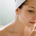 Woman using moisturizing cream