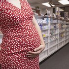 Pregnant woman lying in bed sleeping