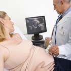 Pregnant Woman And Partner Having 4D Ultrasound Scan