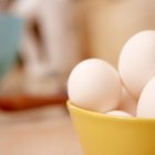 Boiled eggs on wooden background