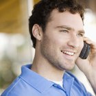 Mixed Race male construction worker using level