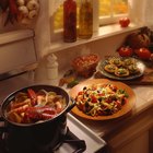 Midsection image of woman cooking food in pan