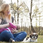 Woman breastfeeding baby in cafe