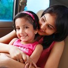 Smiling teenage girl using cell phone