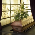 People at burial plot in cemetery