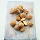 White potatoes in a bowl on a wood table top